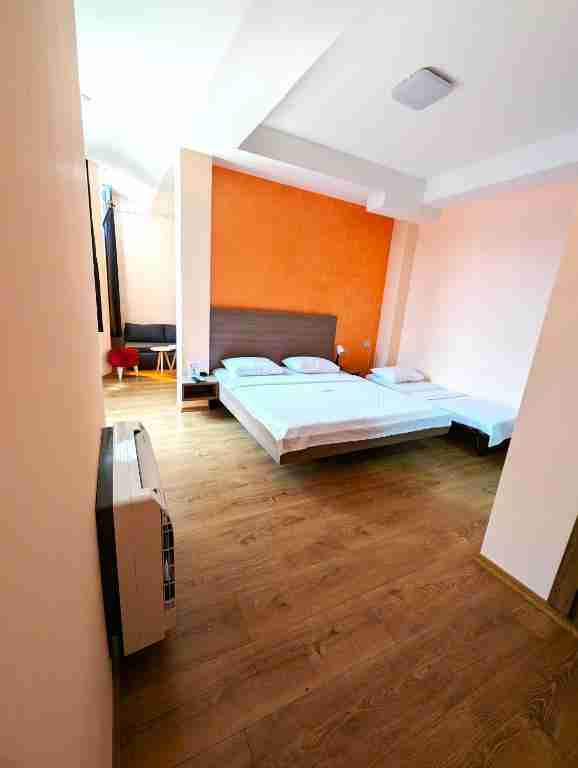 Modern deluxe double bedroom with large bed and natural light in Kumanovo city center apartment